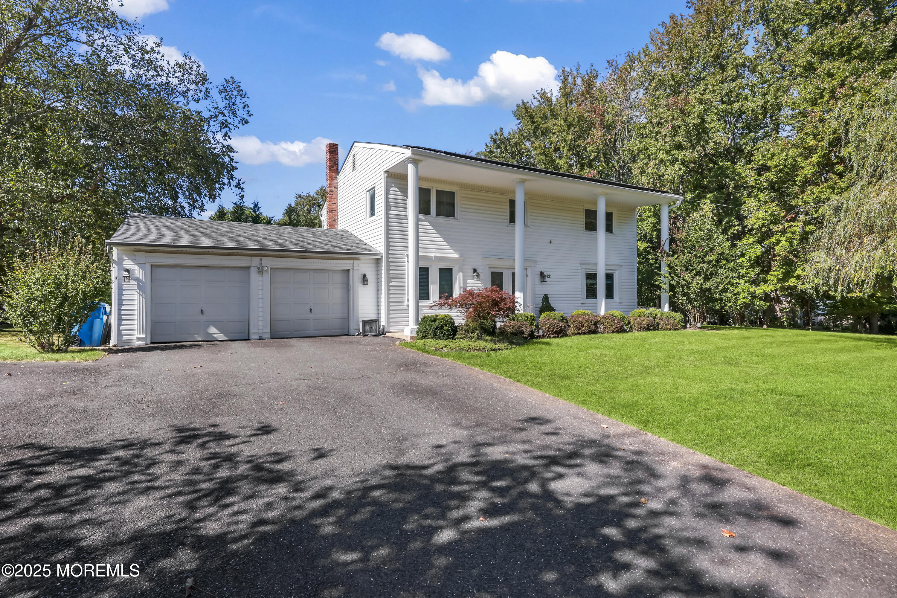 22 Riley Road Morganville, NJ 07751 - Photo 1 of 28 a front view of house with yard and green space