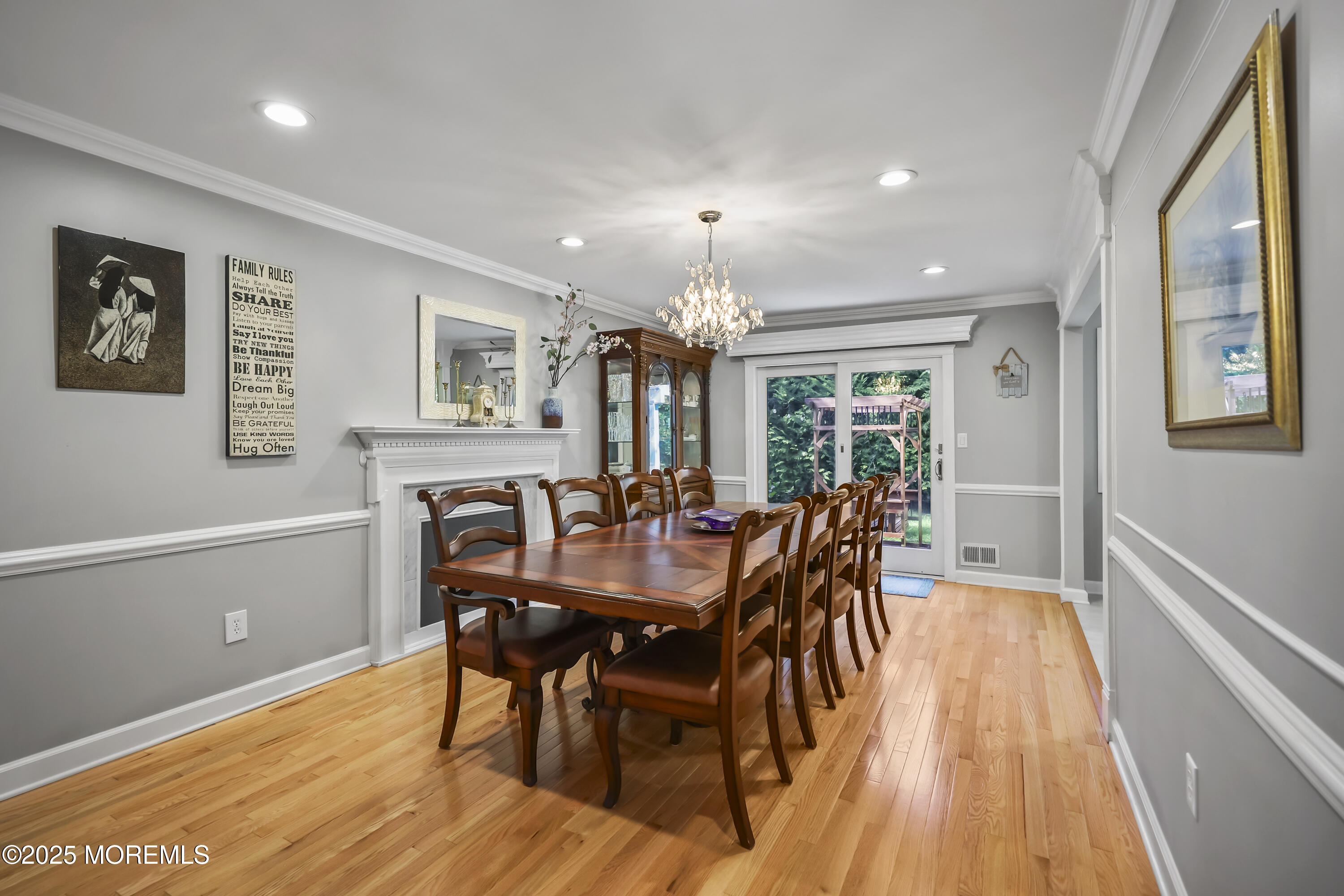 22 Riley Road Morganville, NJ 07751 - Photo 15 of 28 a view of a dining room with furniture window and wooden floor