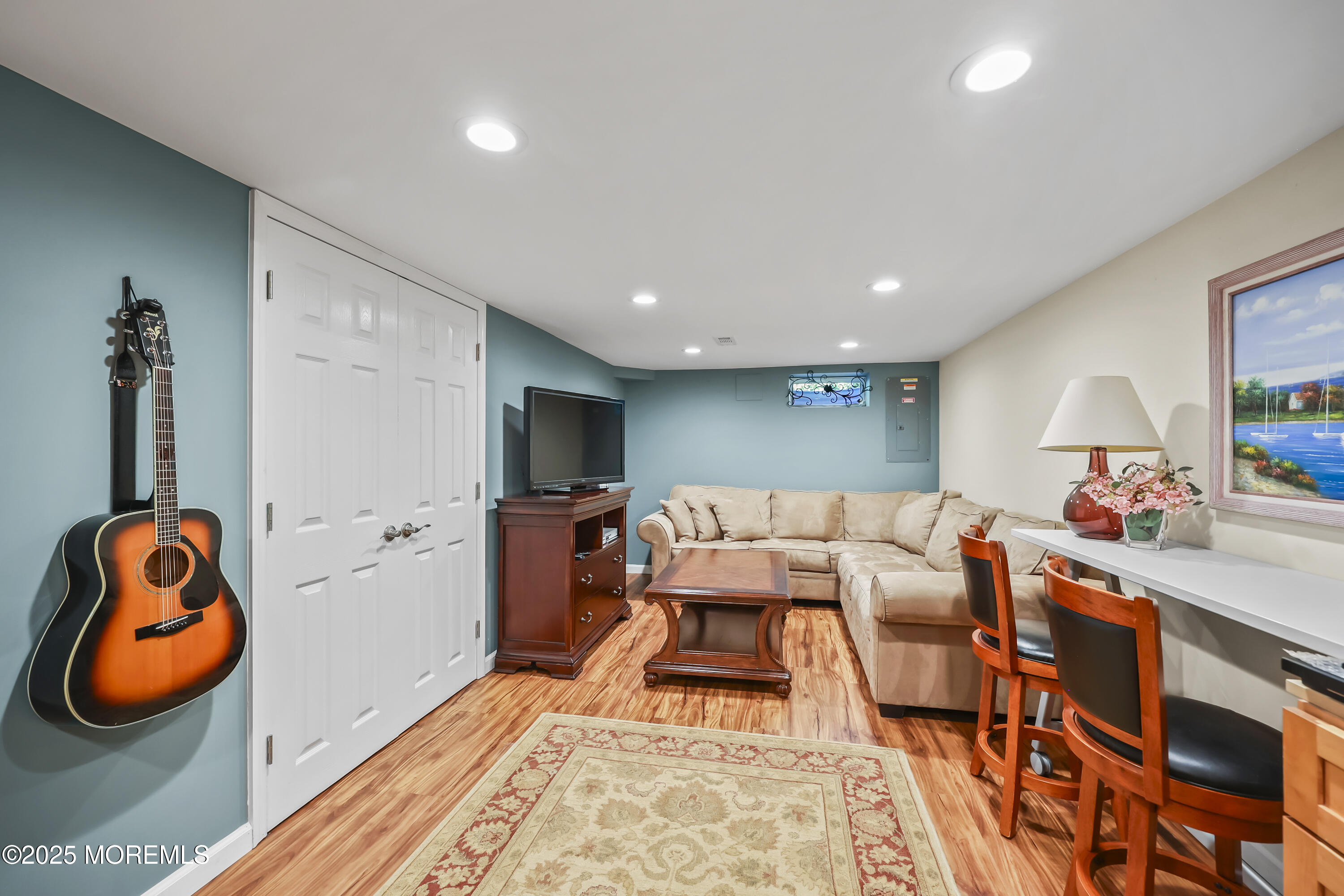 22 Riley Road Morganville, NJ 07751 - Photo 17 of 28 a living room with furniture and a rug