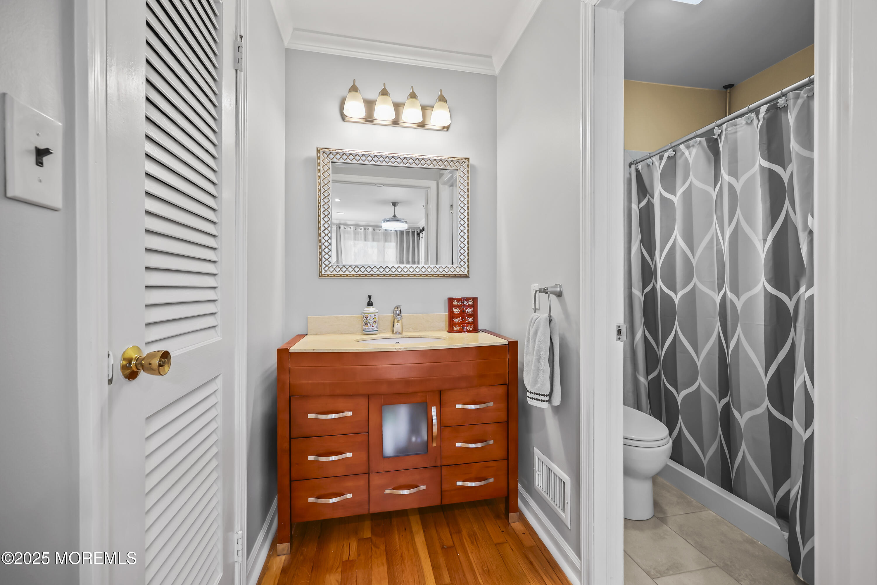 22 Riley Road Morganville, NJ 07751 - Photo 20 of 28 a bathroom with a sink and a mirror