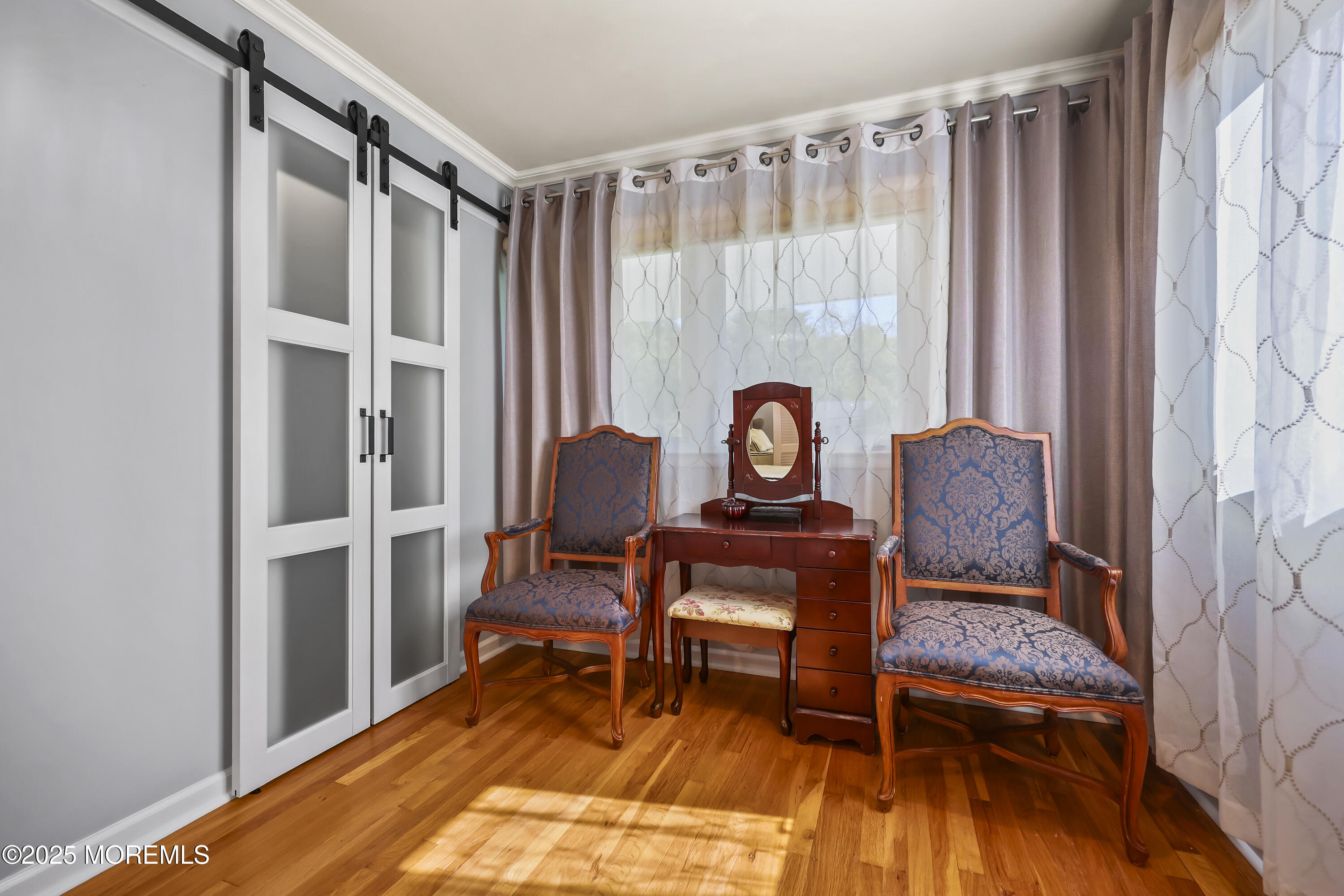 22 Riley Road Morganville, NJ 07751 - Photo 21 of 28 a living room with furniture and a table