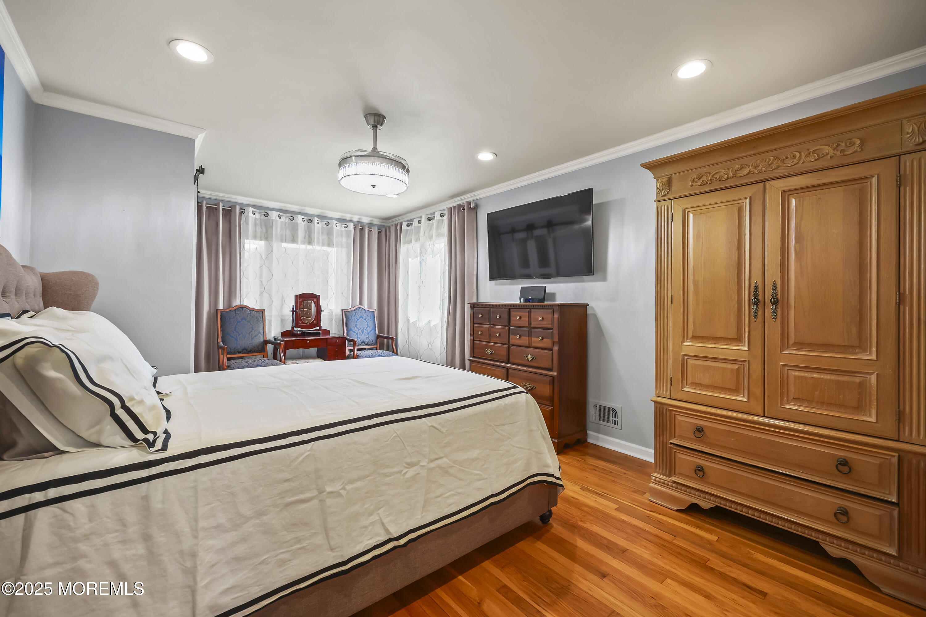 22 Riley Road Morganville, NJ 07751 - Photo 22 of 28 a bed room with a bed and a television