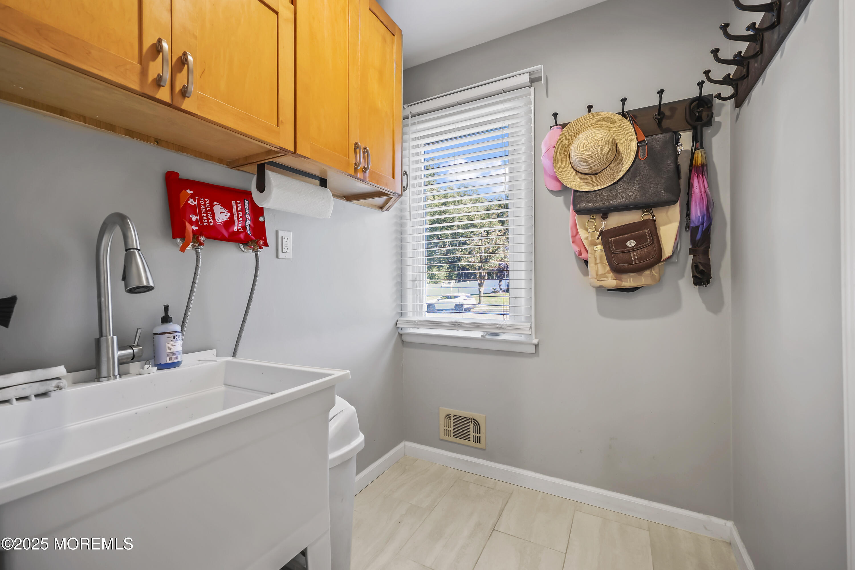 22 Riley Road Morganville, NJ 07751 - Photo 28 of 28 a bathroom with a sink and a mirror