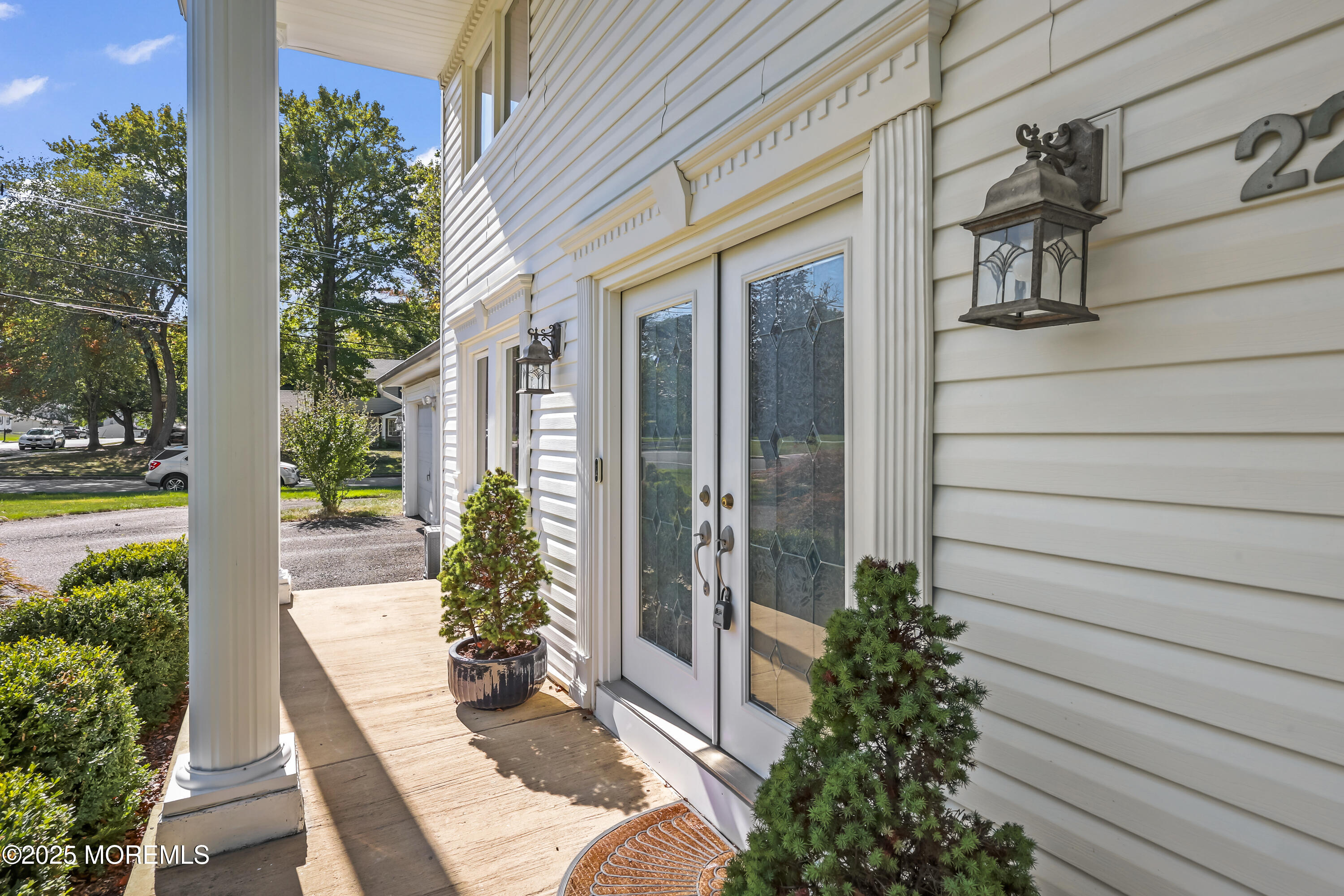 22 Riley Road Morganville, NJ 07751 - Photo 3 of 28 a view of a entryway door front of house