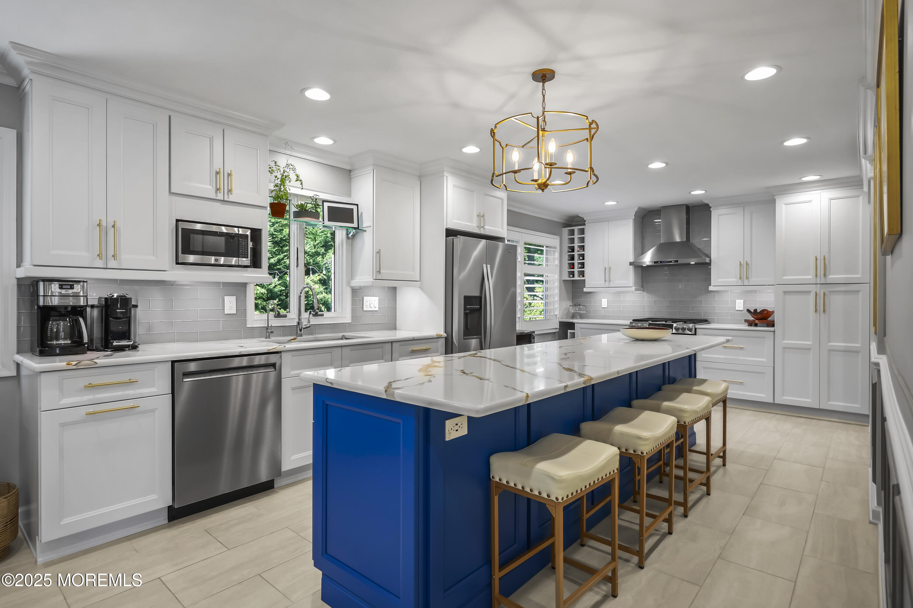 22 Riley Road Morganville, NJ 07751 - Photo 9 of 28 a kitchen with stainless steel appliances granite countertop a sink counter space and chairs in it
