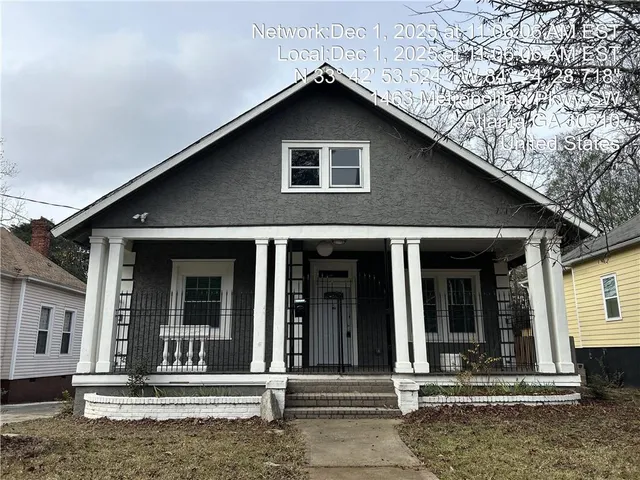 a front view of a house with a porch