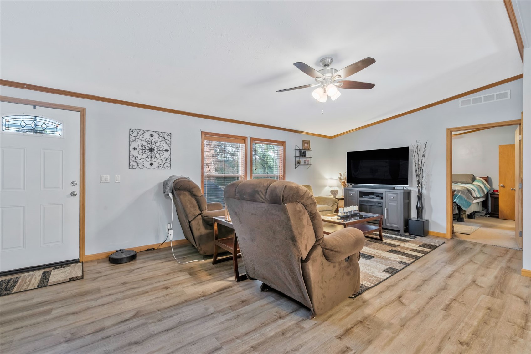 366 South 2nd Street Hayden, CO 81639 - Photo 6 of 38 a living room with furniture a flat screen tv and a ceiling fan