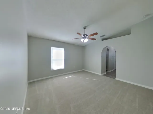 a view of a livingroom with a fan