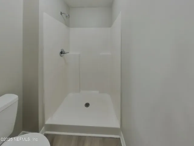 a bathroom with a bathtub and toilet