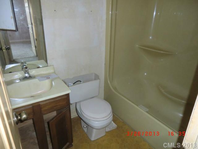 4008 Wynbrook Way Monroe, NC 28112 - Photo 12 of 15 a bathroom with a sink toilet and shower
