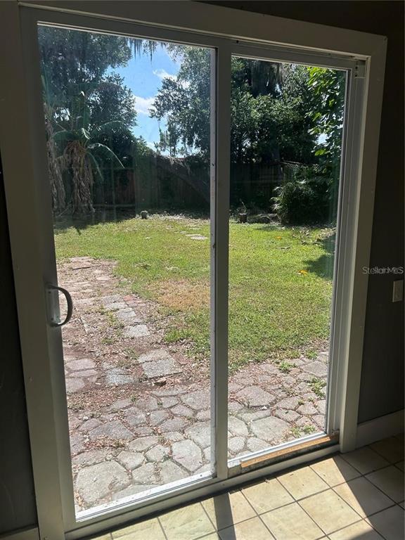 232 Beverly Boulevard Brandon, FL 33511 - Photo 12 of 32 a view of a room with a large window and wooden floor