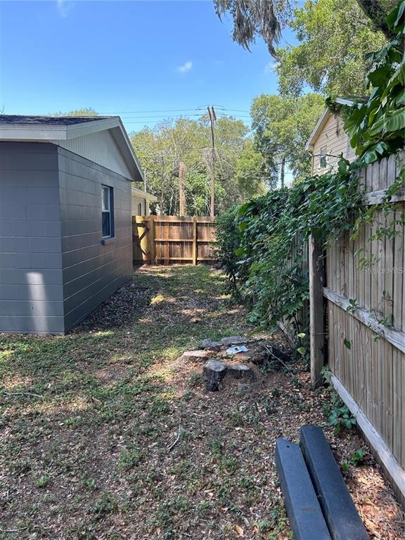 232 Beverly Boulevard Brandon, FL 33511 - Photo 16 of 32 a view of a house with a yard and wooden fence
