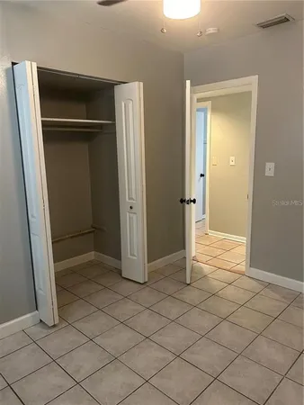 an empty room with wooden door