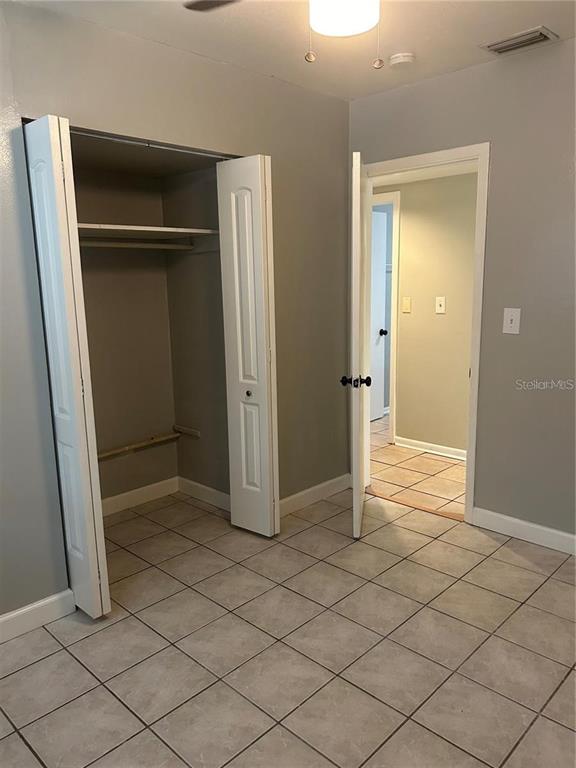 232 Beverly Boulevard Brandon, FL 33511 - Photo 20 of 32 an empty room with wooden door