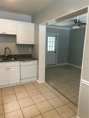 a kitchen with a sink and cabinets