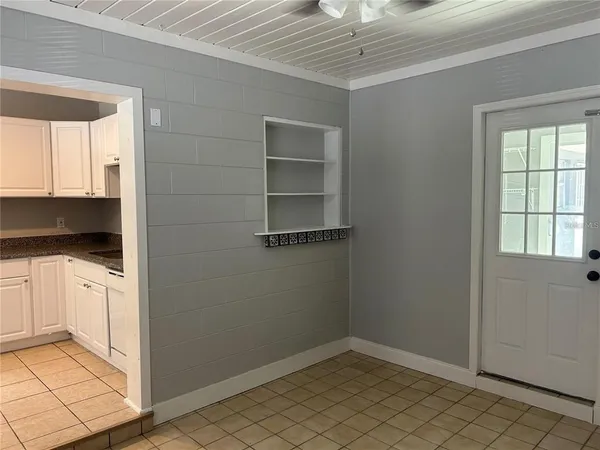 a view of an empty room with a window