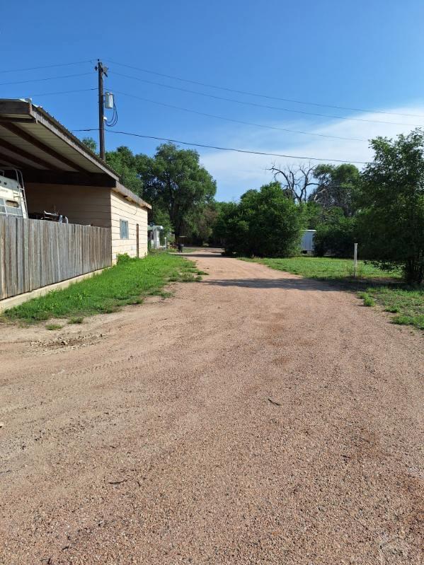 503 Division Street Lamar, CO 81052 - Photo 5 of 11 a backyard of a house with lots of green space