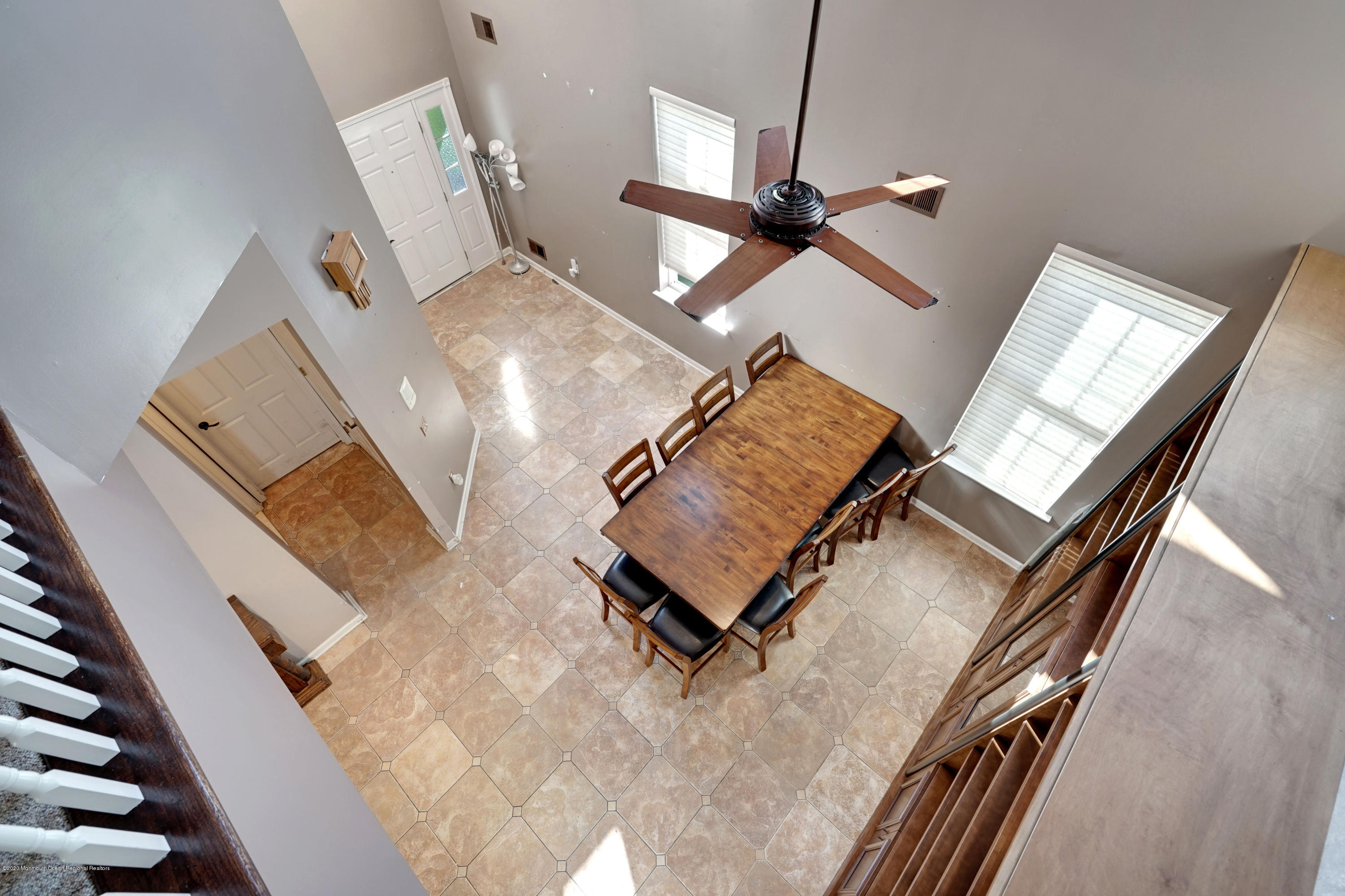 27 Crooked Stick Road Jackson, NJ 08527 - Photo 22 of 32 a living room with furniture and a chandelier