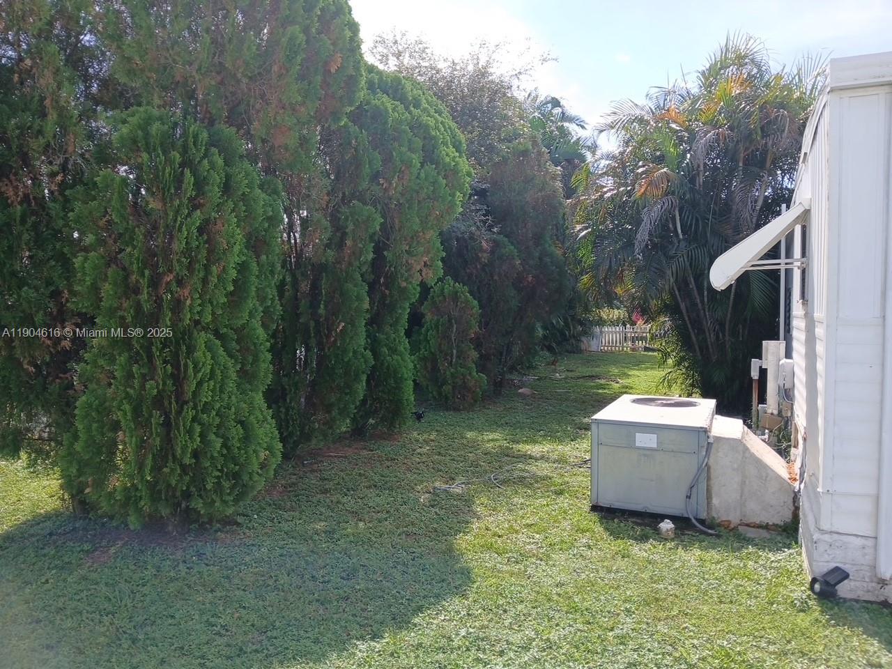 1860 Southwest 83rd Terrace Davie, FL 33324 - Photo 12 of 12 a garden view with a seating space