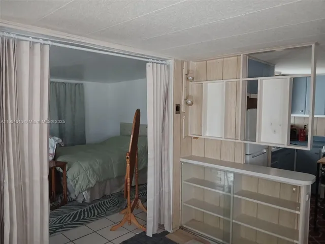 a bathroom with a shower and a sink