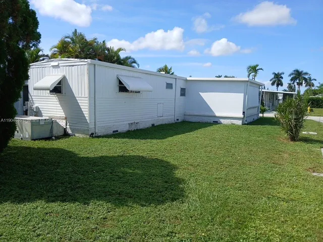 a view of a back yard of the house