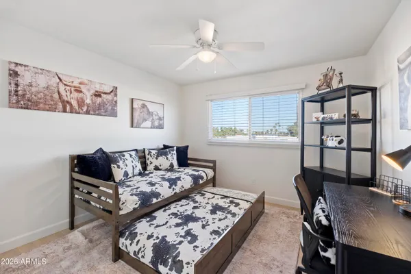 a living room with furniture rug and window