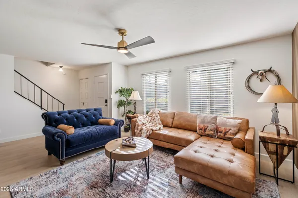 a living room with furniture and a large window