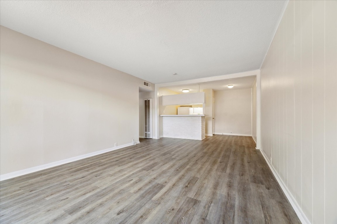 3259 Branard Street, Unit 7 Houston, TX 77098 - Photo 3 of 10 a view of empty room with wooden floor and window