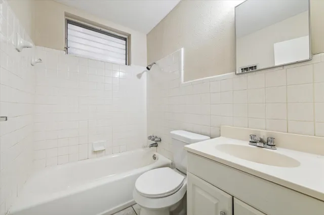 a bathroom with a sink toilet and a bathtub