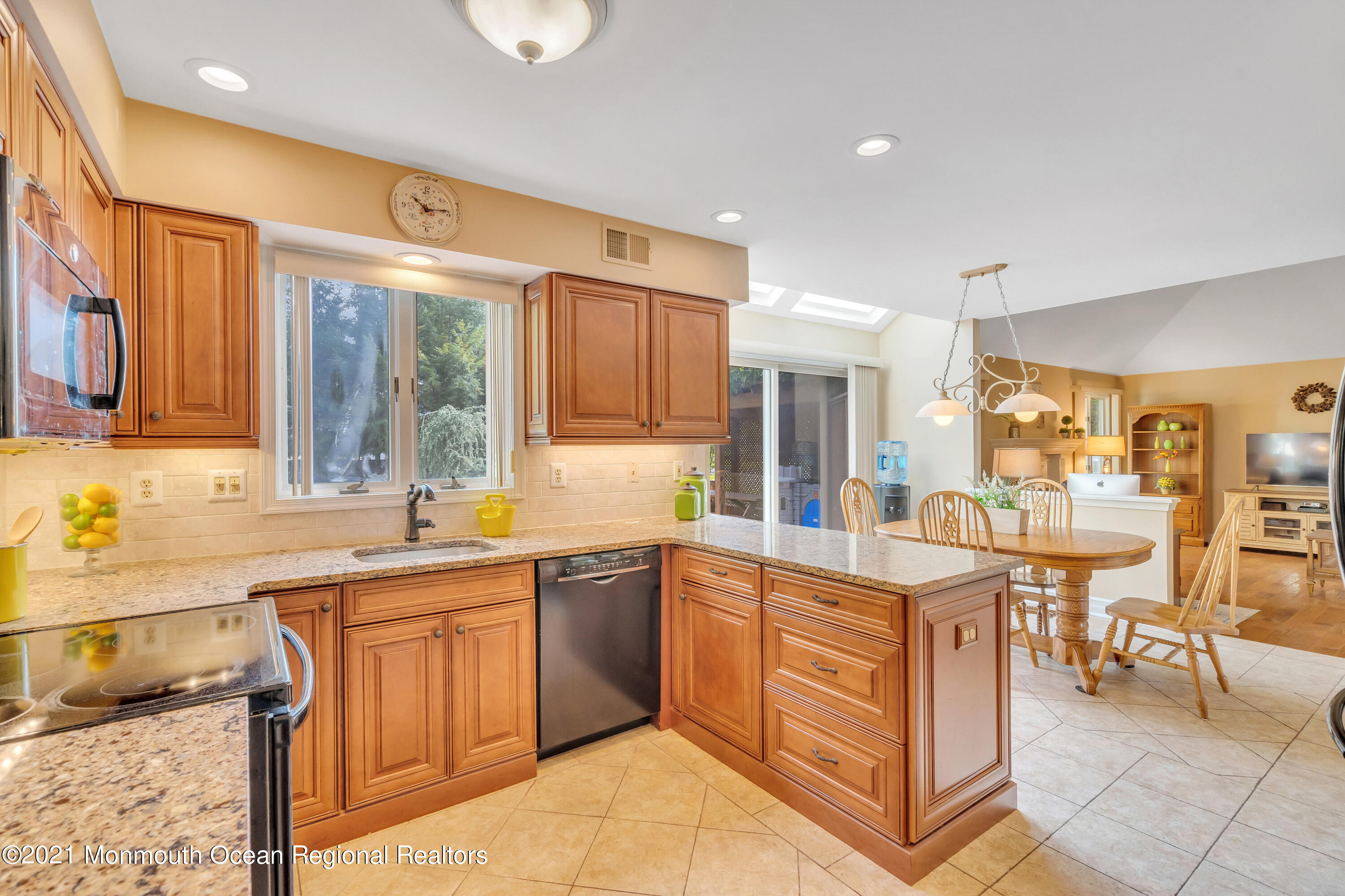 230 Crest Hill Road Toms River, NJ 08755 - Photo 24 of 59 a kitchen with a sink and chairs