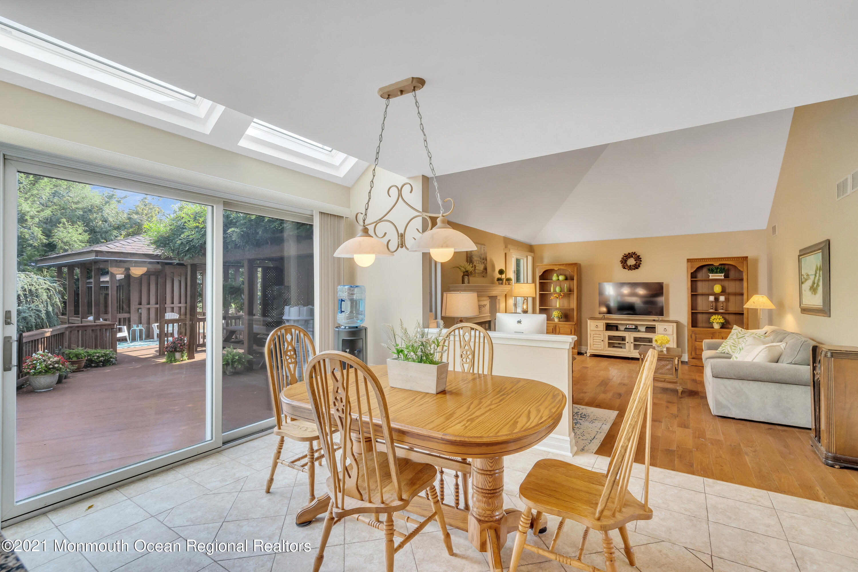 230 Crest Hill Road Toms River, NJ 08755 - Photo 26 of 59 a dining room with furniture a chandelier and wooden floor