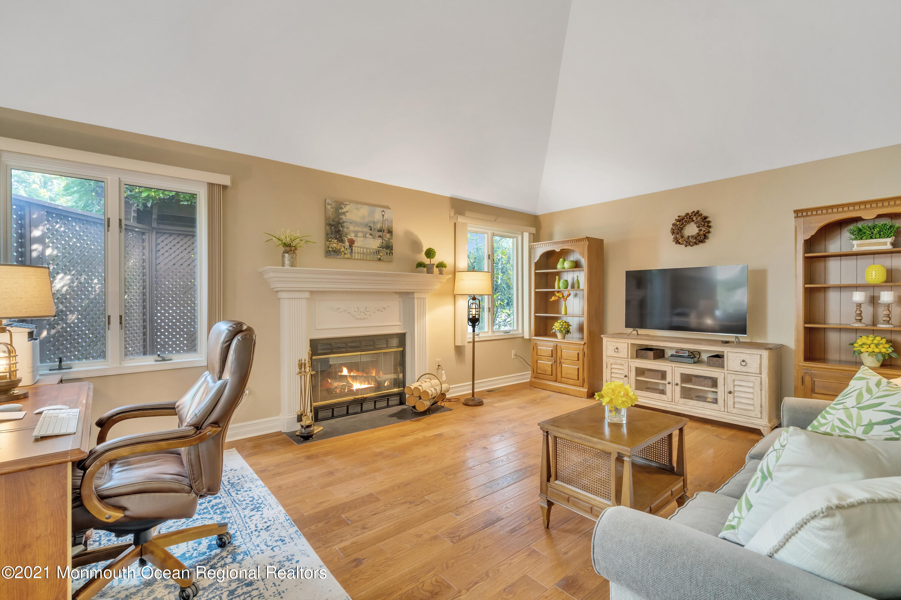 230 Crest Hill Road Toms River, NJ 08755 - Photo 28 of 59 a living room with furniture a flat screen tv and a fireplace