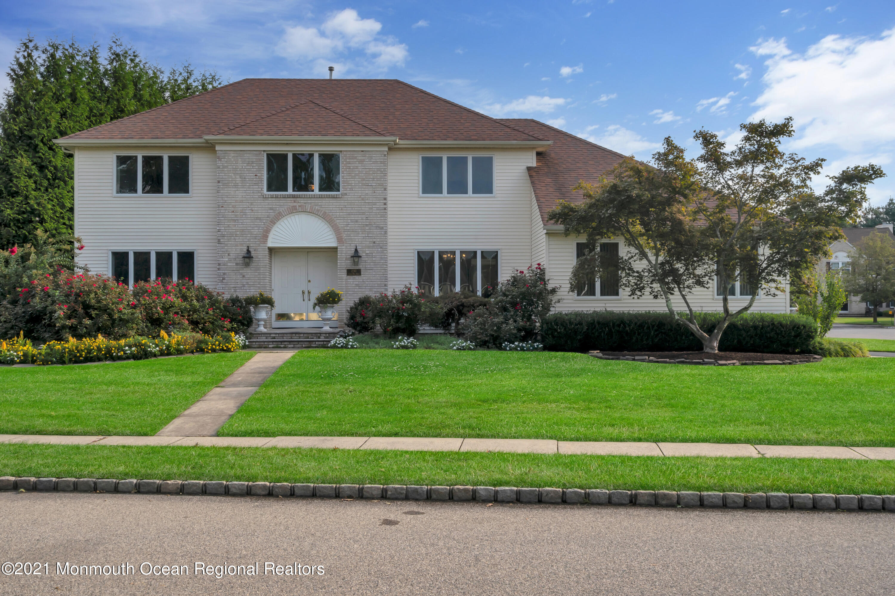 230 Crest Hill Road Toms River, NJ 08755 - Photo 4 of 59 a front view of a house with a yard and trees