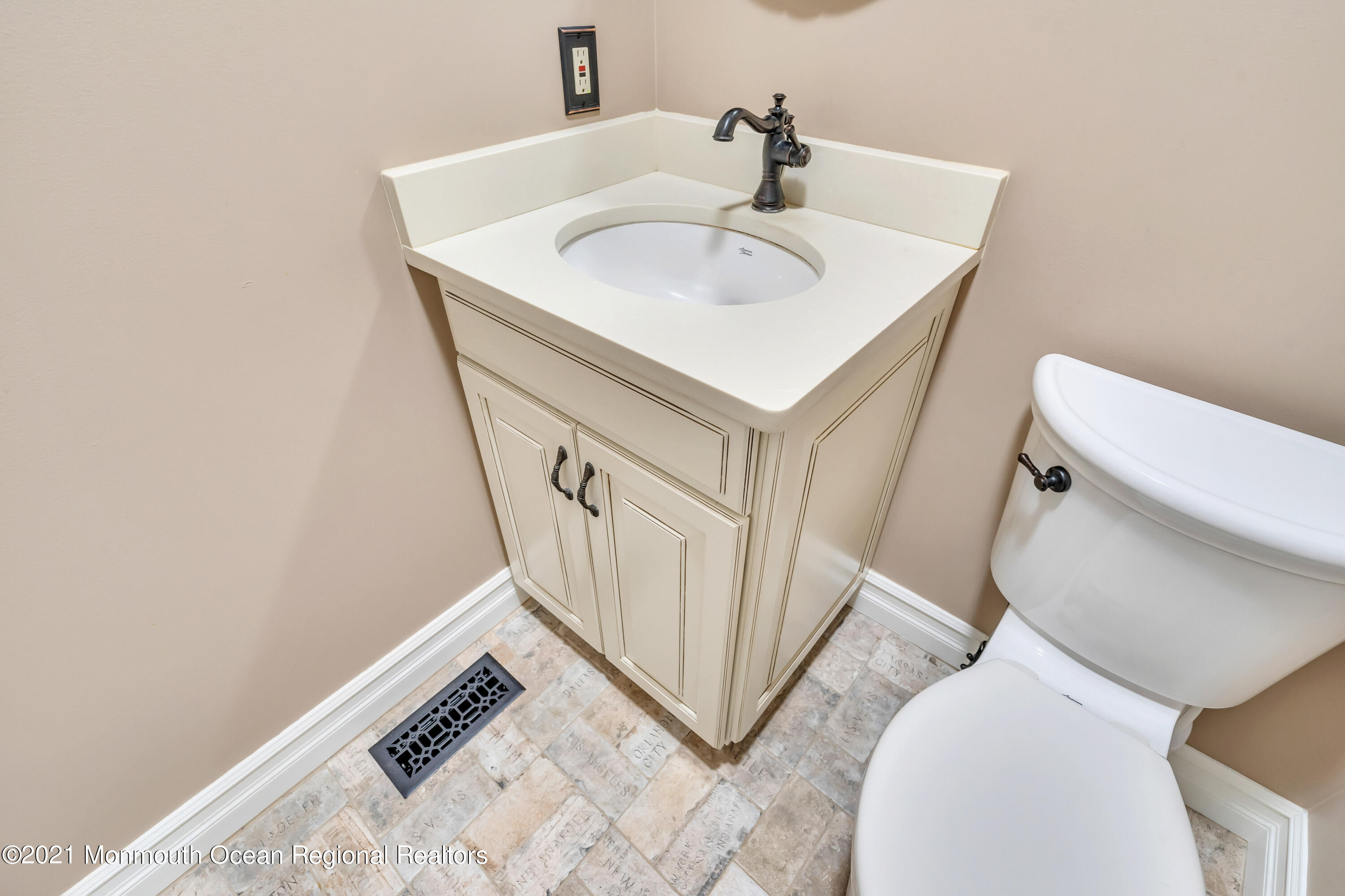 230 Crest Hill Road Toms River, NJ 08755 - Photo 31 of 59 a bathroom with a sink toilet and a mirror
