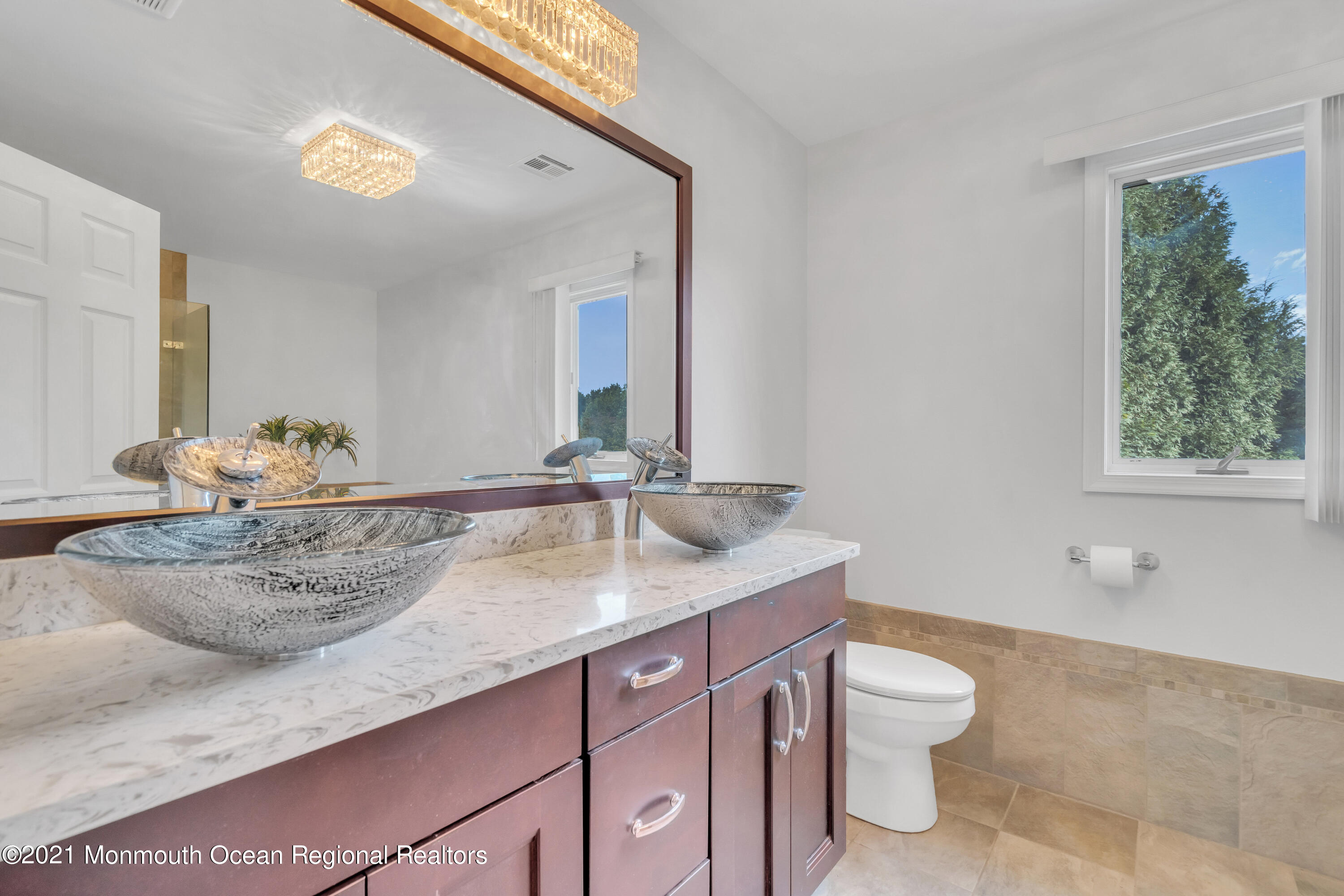 230 Crest Hill Road Toms River, NJ 08755 - Photo 36 of 59 a bathroom with a granite countertop sink and a mirror