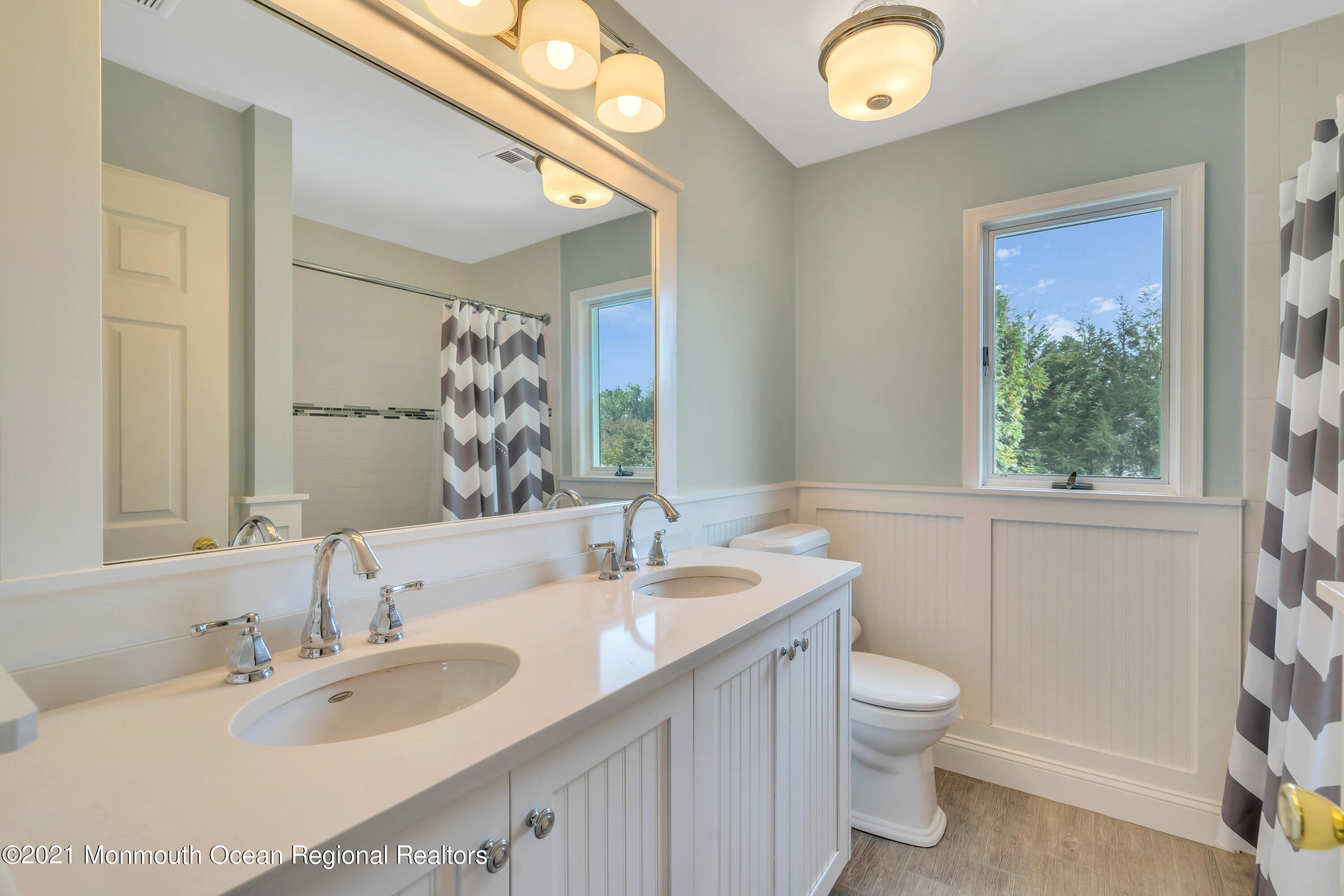 230 Crest Hill Road Toms River, NJ 08755 - Photo 41 of 59 a bathroom with a granite countertop sink mirror vanity and toilet