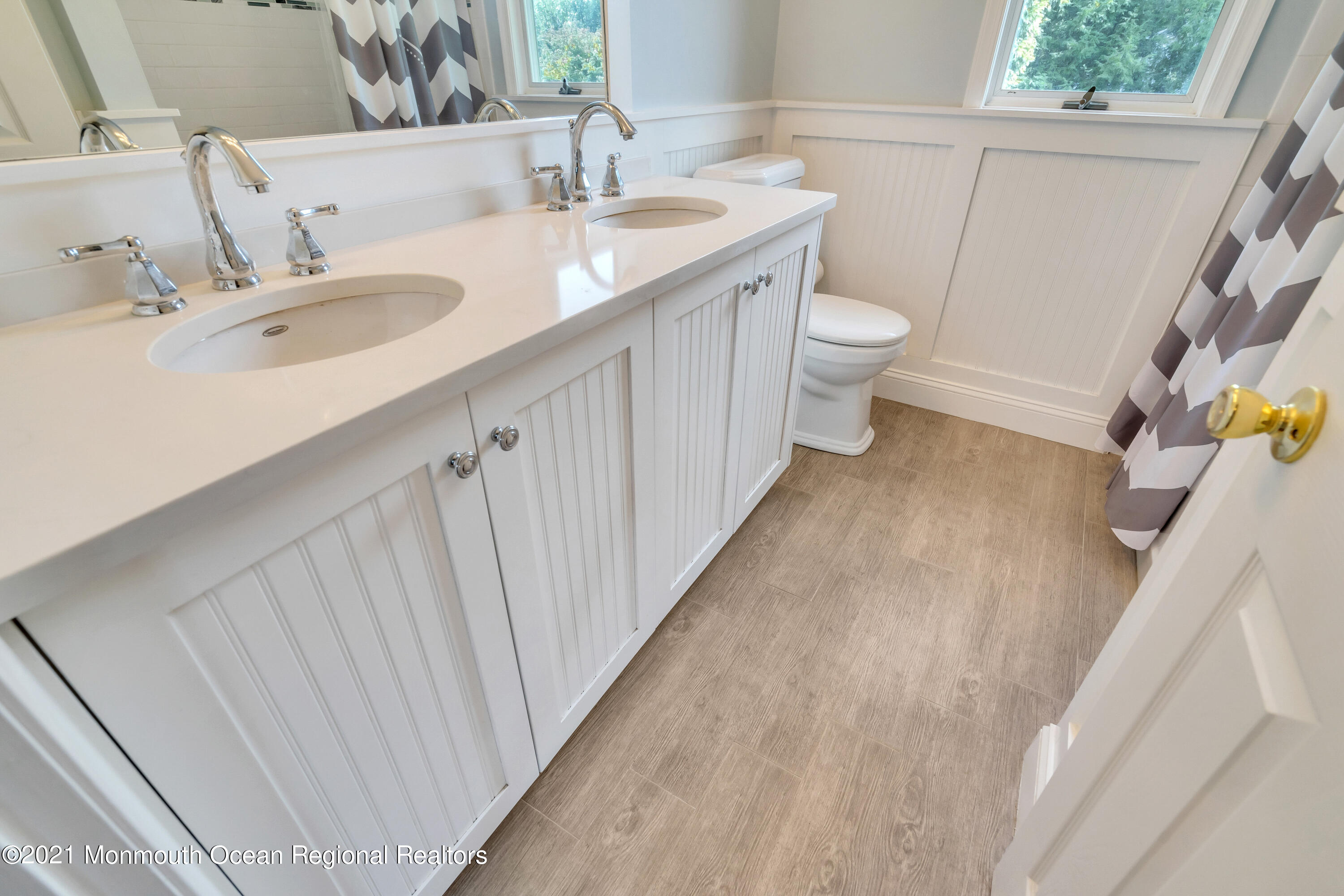 230 Crest Hill Road Toms River, NJ 08755 - Photo 42 of 59 a bathroom with a sink and a mirror
