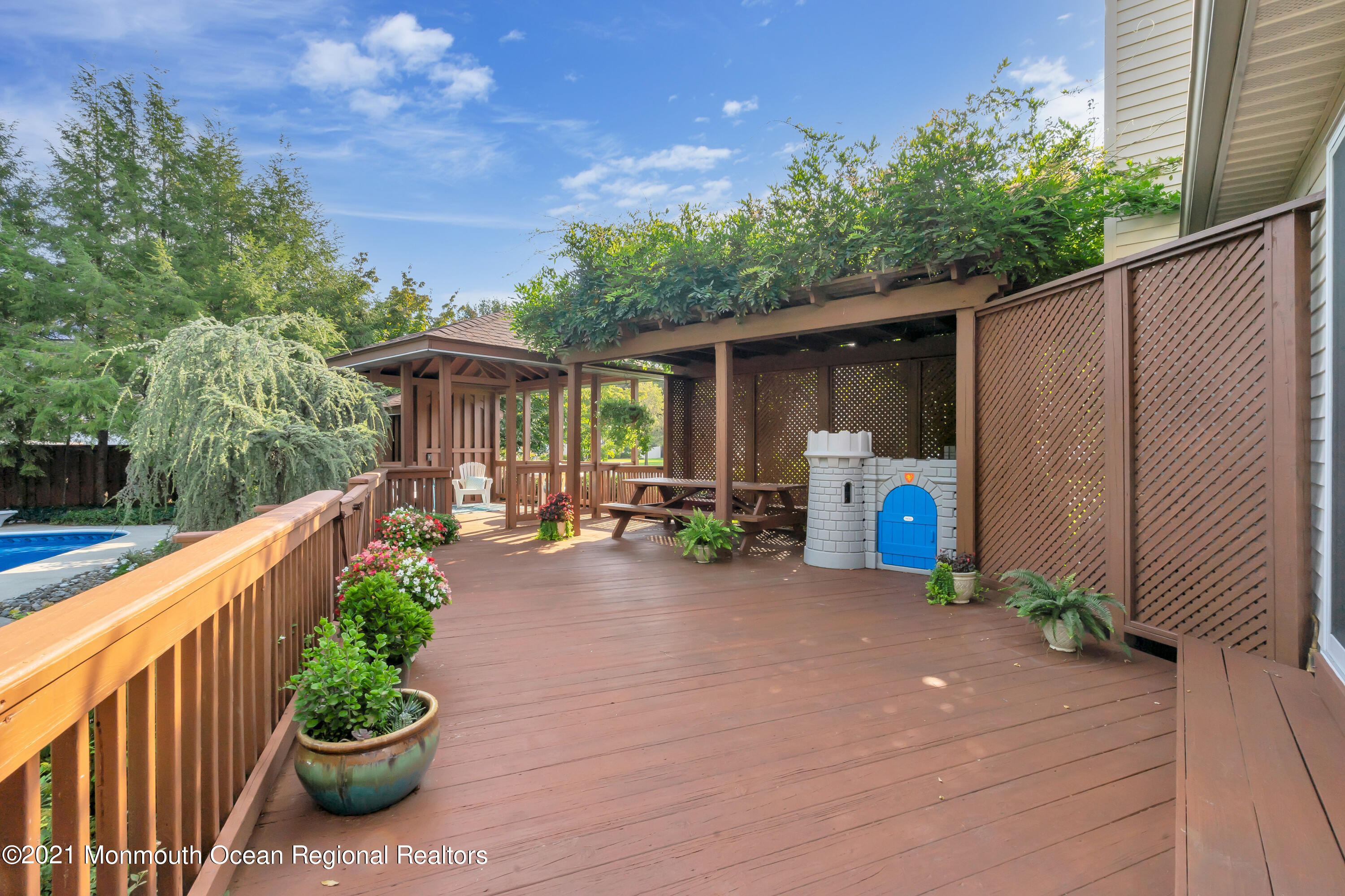 230 Crest Hill Road Toms River, NJ 08755 - Photo 49 of 59 a view of a patio with chairs and potted plants