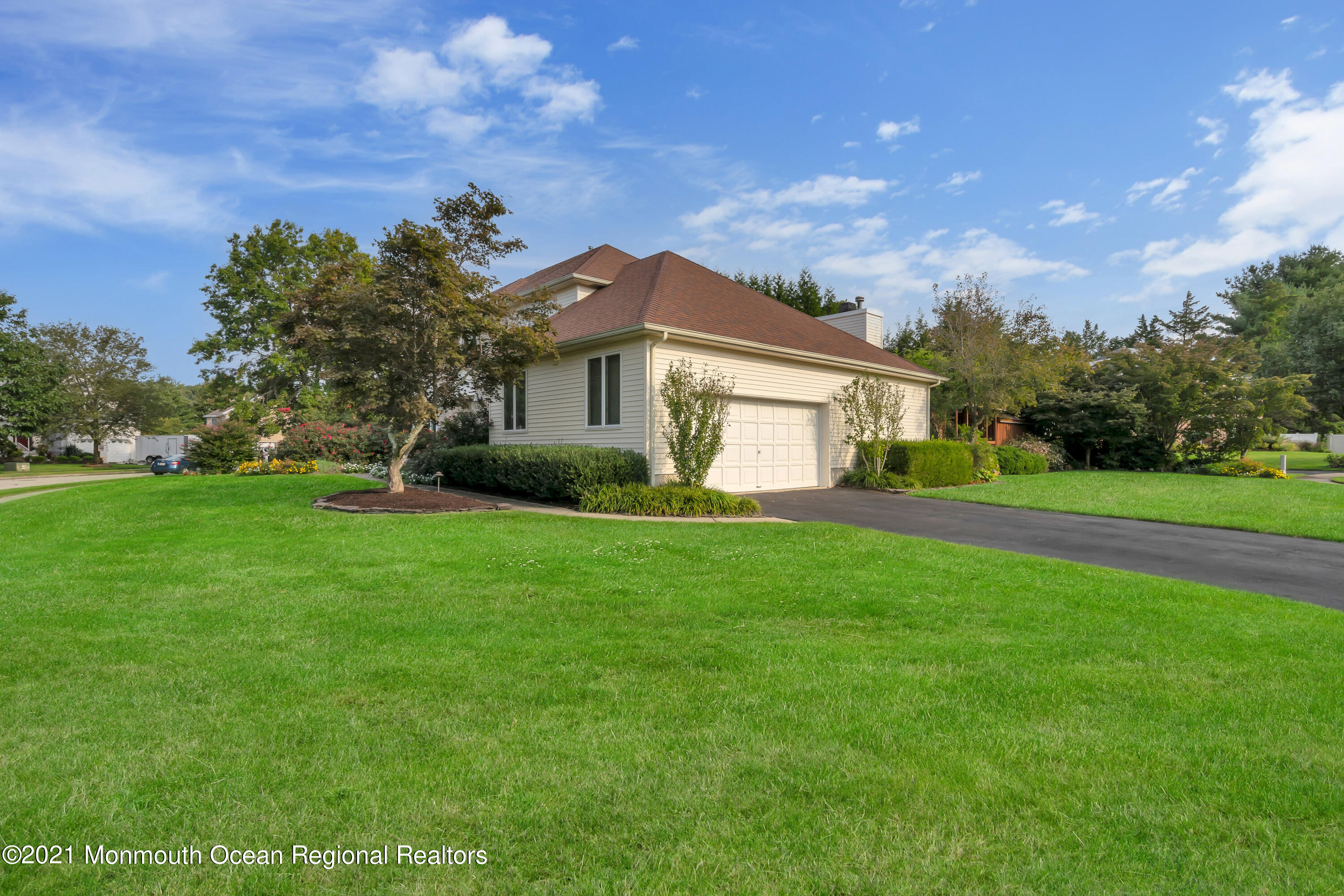 230 Crest Hill Road Toms River, NJ 08755 - Photo 6 of 59 a front view of a house with garden
