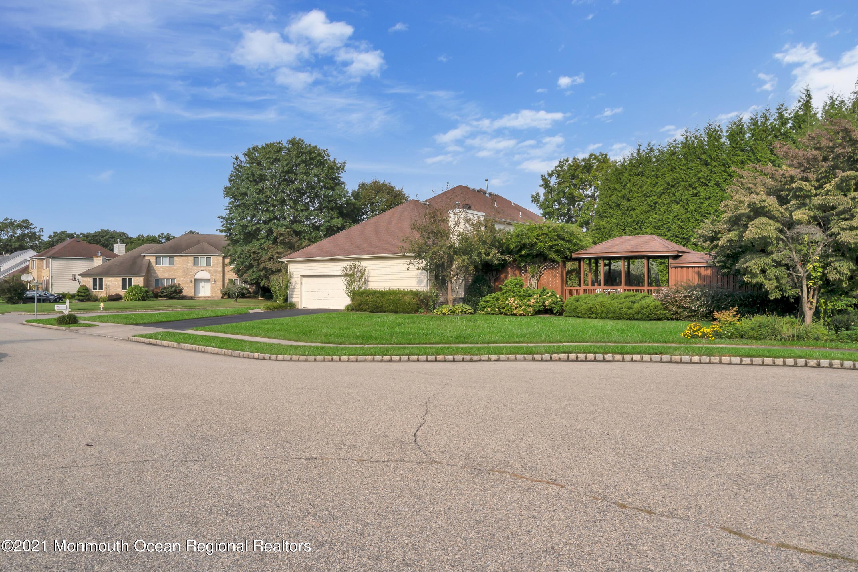 230 Crest Hill Road Toms River, NJ 08755 - Photo 58 of 59 a front view of a house with a yard and trees