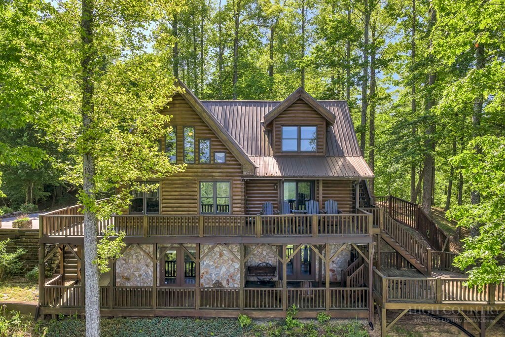 2229 Elk Ridge Road Ferguson, NC 28624 - Photo 8 of 42 a front view of a house with garage