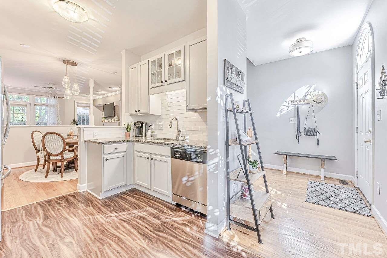 125 Fenner Lane Raleigh, NC 27603 - Photo 13 of 30 a kitchen with a sink a counter and appliances