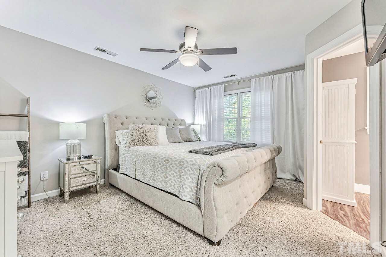 125 Fenner Lane Raleigh, NC 27603 - Photo 20 of 30 a bedroom with bed and window