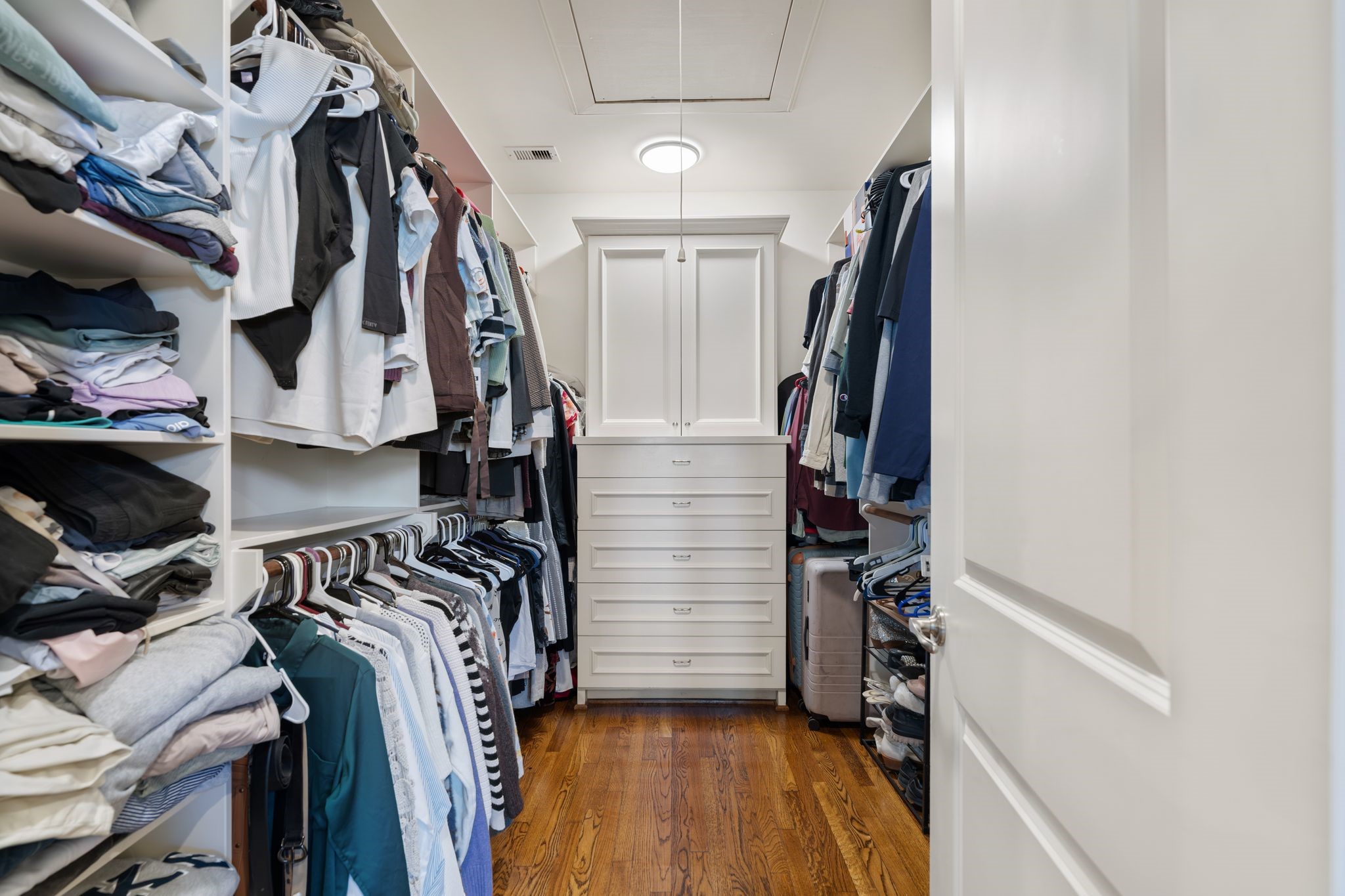 2502 Lawrence Street Houston, TX 77008 - Photo 18 of 26 Fabulous walk-in closet with built-in shelves and dresser
