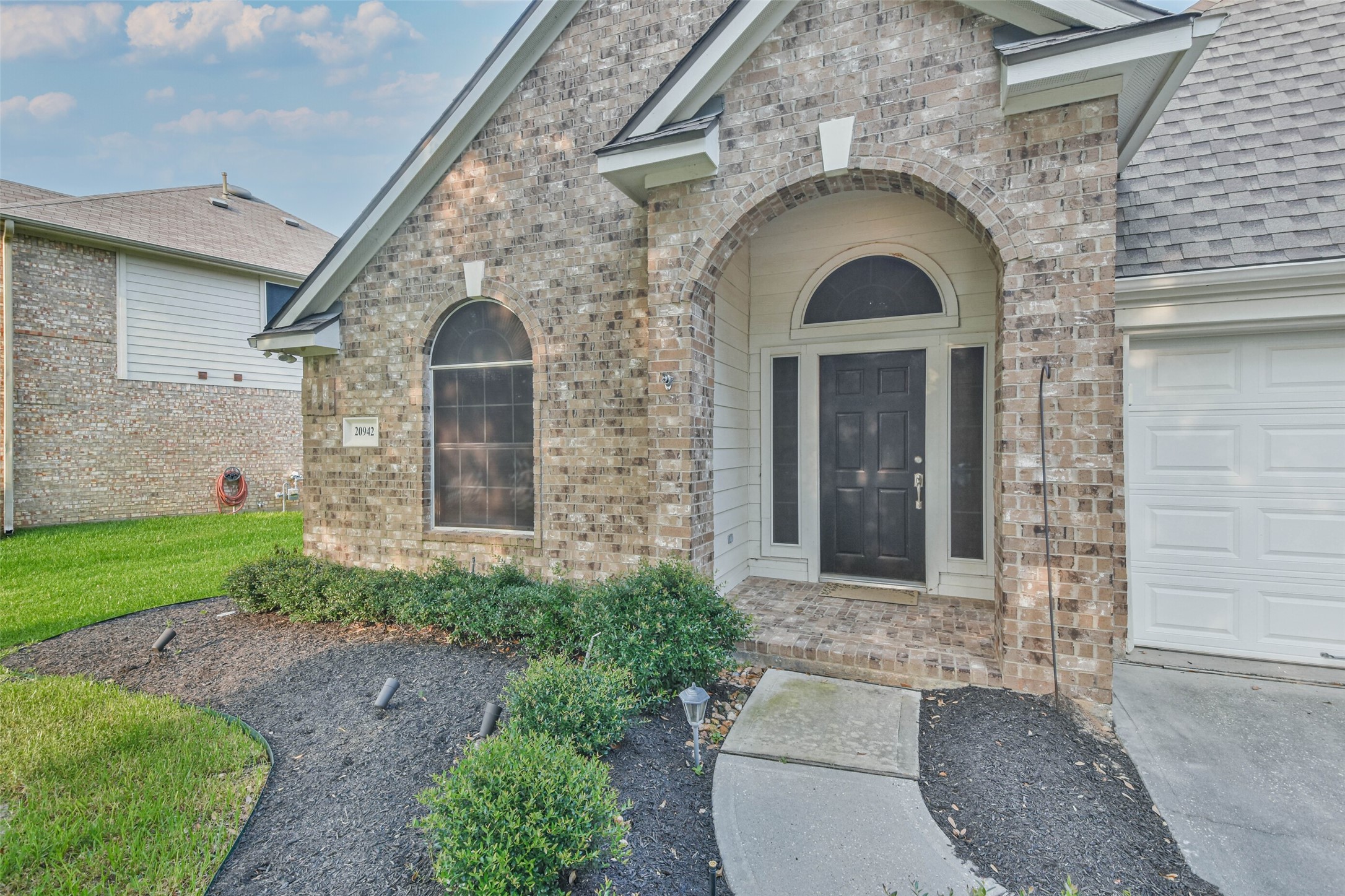 20942 Wind Field Lane Spring, TX 77379 - Photo 3 of 46 a front view of a house with garden