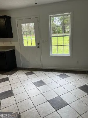 a view of empty room with windows