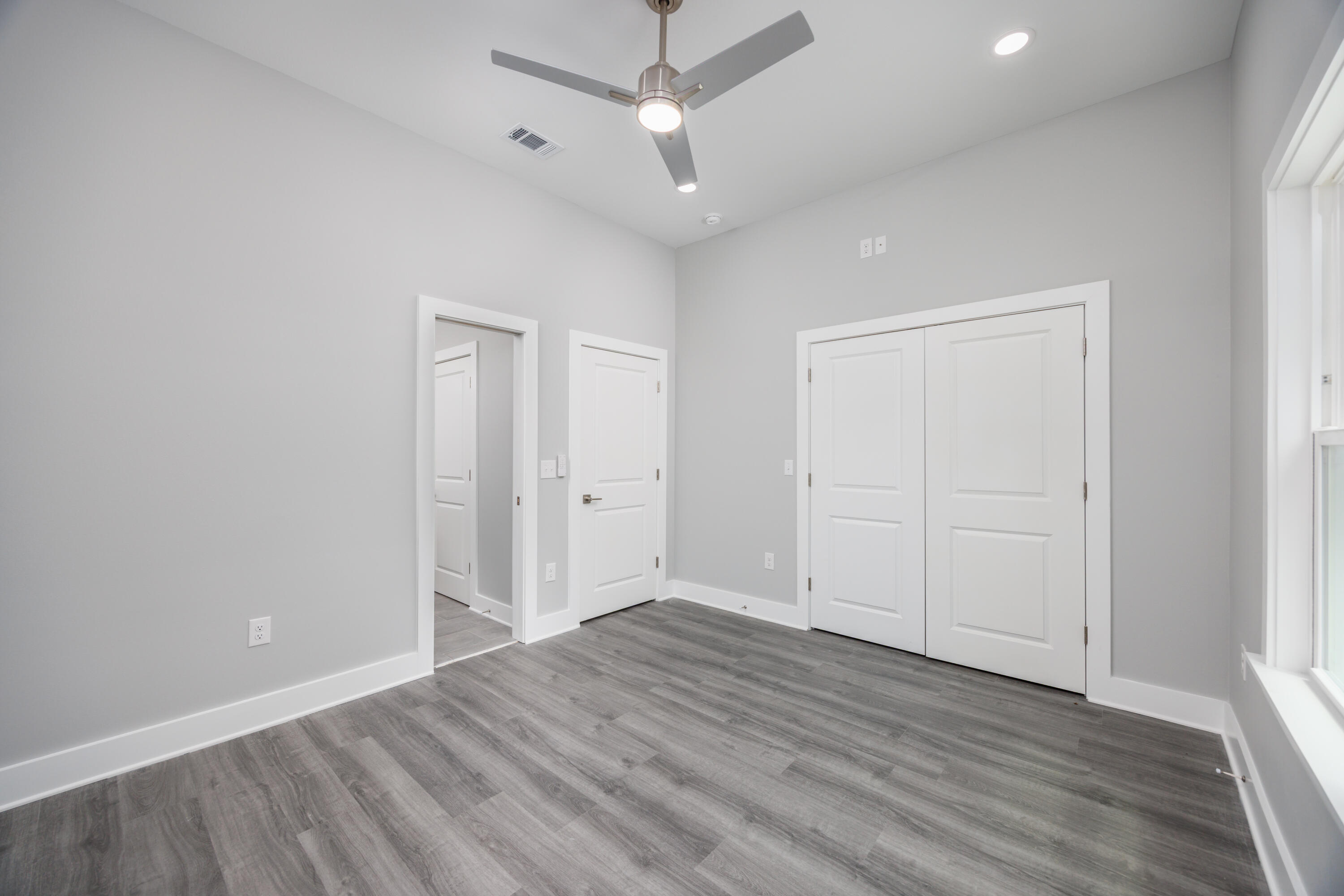 26 Shebbi Lane Freeport, FL 32439 - Photo 12 of 19 wooden floor in an empty room with a window