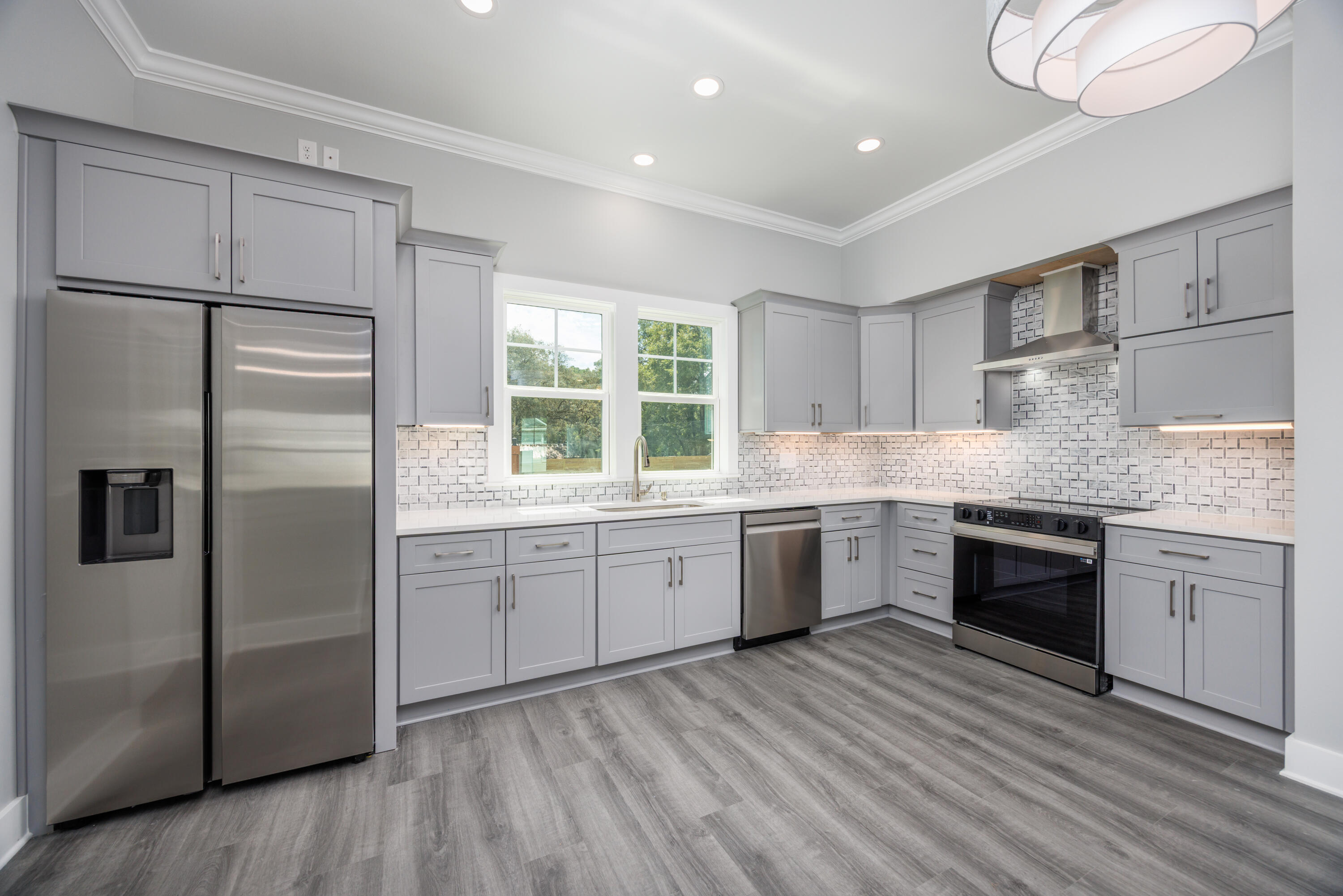 26 Shebbi Lane Freeport, FL 32439 - Photo 6 of 19 a kitchen with granite countertop stainless steel appliances a sink and cabinets