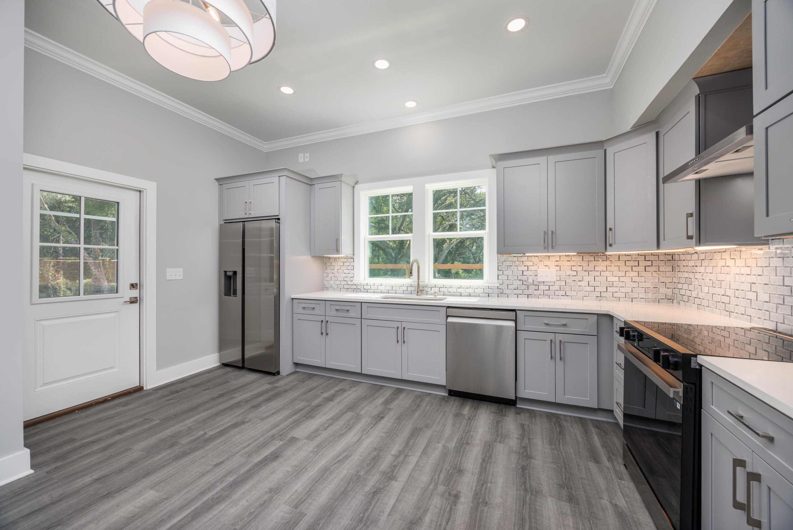 26 Shebbi Lane Freeport, FL 32439 - Photo 8 of 19 a kitchen with granite countertop appliances cabinets and a large window