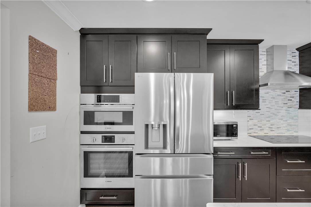 3396 Darien Road Bethlehem, PA 18020 - Photo 13 of 44 A well-appointed culinary space showcasing modern stainless steel appliances integrated into sleek cabinetry.